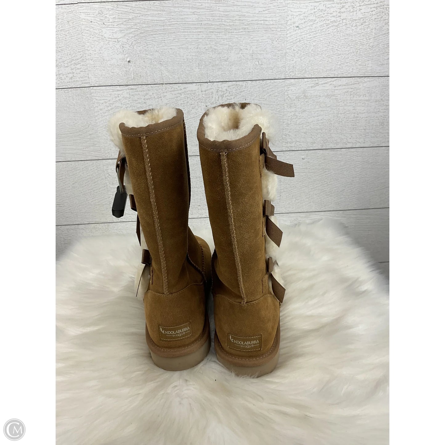Boots Designer By Ugg In Brown, Size: 9